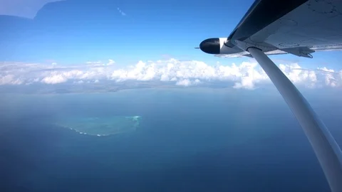 Airplane flight Take-Off A Jet Plane Flying to Zanzibar clouds View From Window Stock Footage 90491827