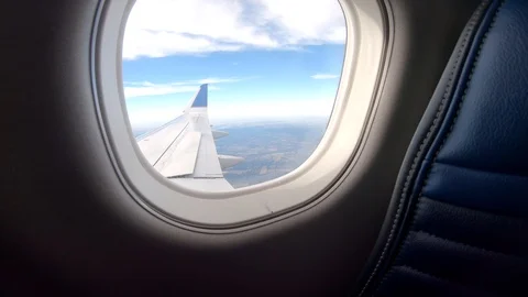 Airplane flight Take-Off A Jet Plane Flying over clouds View From Window Stock Footage 116323097