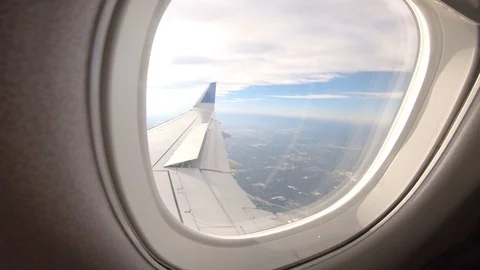 Airplane flight Take-Off A Jet Plane Flying over clouds View From Window Stock Footage 116326039