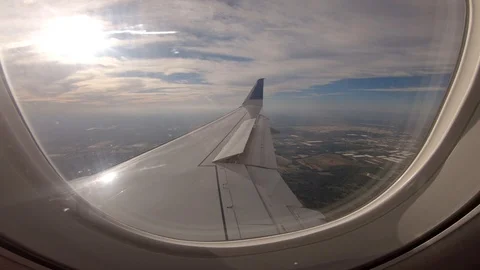Airplane flight Take-Off A Jet Plane Flying over clouds View From Window Stock Footage 116326616