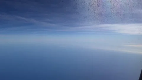 Airplane flight view from window above blue sea and sky horizon Stock Footage 339353284