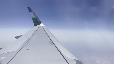 Airplane flight. View from the window on the wing of an airplane flying Stock-Footage 247192381