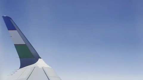 Airplane flight. View from the window on the wing of an airplane flying Stock Footage 247784730