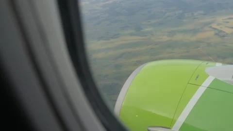 Airplane flight. Wing of an airplane flying above the clouds with sunset sky Stock-Footage 149763583