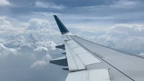 Airplane flight. Wing of an airplane flying above the clouds. Stock Footage 205534331
