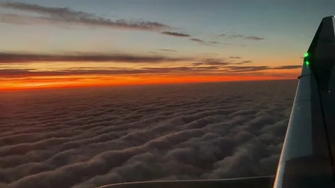 Airplane flight. Wing of an KLM airplane flying above the clouds Stock Footage 170651513