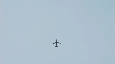 Airplane fly away though the blue sky. Large passenger airplane is taking off Stock Footage 266752873