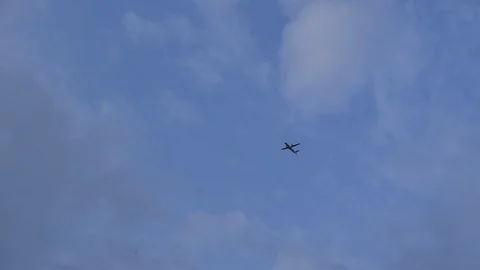 Airplane fly on blue sky Stock Footage 90784850