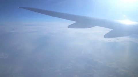 The airplane fly on the bright sun background. Wide angle. Real time capture Video stock 72249197