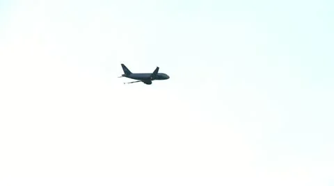 Airplane fly over the city Stock Footage 10818964