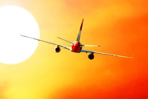 Airplane at fly on the sky with clouds Foto stock