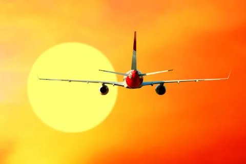 Airplane at fly on the sky with clouds Stock Photos