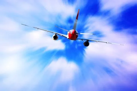 Airplane at fly on the sky with clouds Stock Photos
