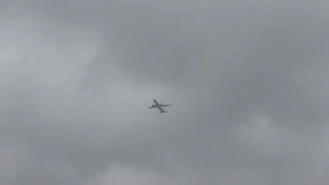 An airplane flyes through the clouds 4k 30fps video Stock Footage 232723661