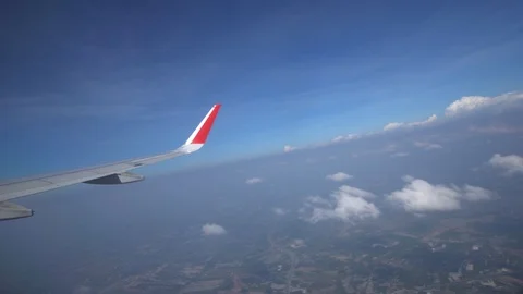 Airplane flying above cloud, View through an airplane window Video stock 99490813