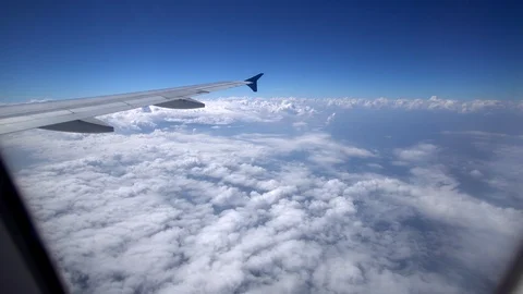 Airplane flying above cloud, View through an airplane window Stock Footage 100275981