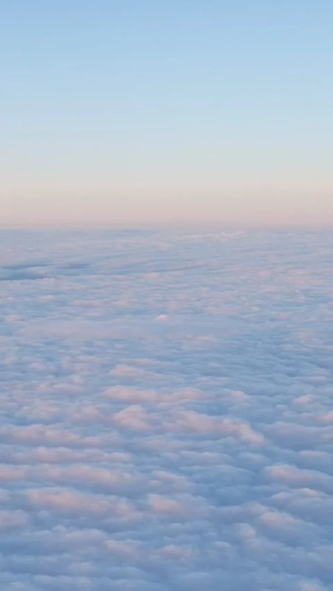 Airplane flying above clouds during sunset Stock Footage 341443520