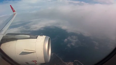 Airplane flying above the clouds Stock Footage 133833157