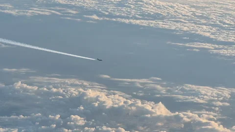 Airplane flying above the clouds 動画素材 345098437