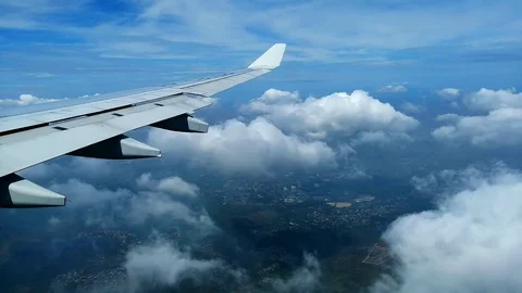 An airplane flying above clouds over the Philippines Stock Footage 110721028