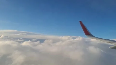 An airplane flying above the clouds is a scene of air travel. Stock Footage 307566467
