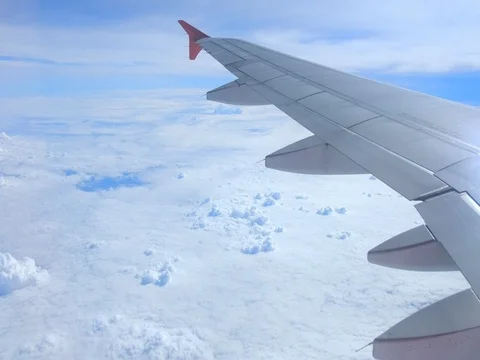 Airplane is flying above the clouds, view through from window Stock Footage 73762131