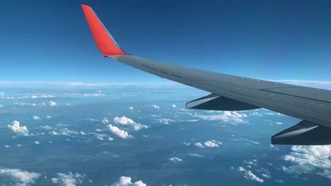 Airplane is flying above the clouds, wing of the plane swings from the wind Video stock 142104423