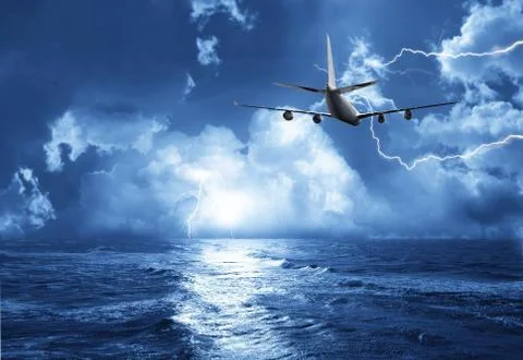 Airplane flying above dramatic clouds during sunset,sunrise. Stock Photos