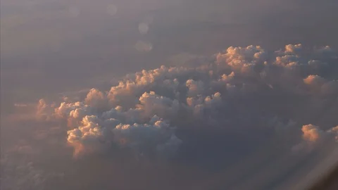 Airplane Flying Above the Evening Clouds with Sunset Sky, View from the Window 動画素材 123199056