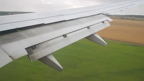 Airplane flying above the fields in slow motion 180fps Stock Footage 165333582