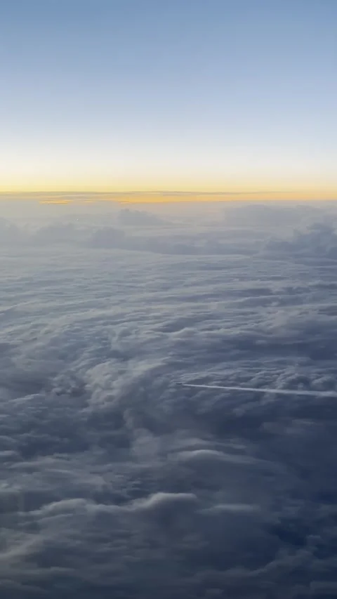 Airplane Flying Above White Clouds in Blue Sky Aerial View Stock Footage 330731402