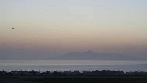 Airplane flying across a mountain site Stock Footage 101728166
