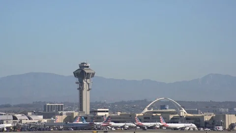 Airplane flying up and down of the busy Los Angeles International Airport Stock Footage