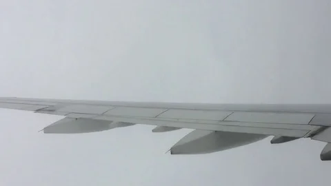 Airplane flying in and out of clouds Video stock 81839348