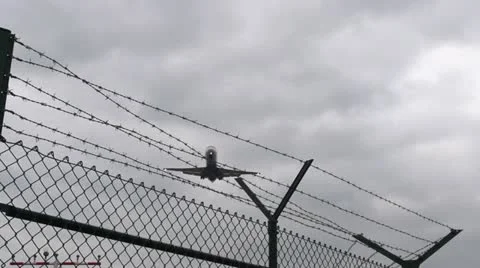 Airplane flying barbed wire - slow motion Stock Footage 21360152