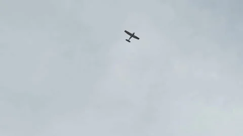 The airplane is flying in a blue cloudy sky Stock Footage 258772697