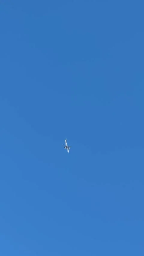 Airplane Flying in the Blue Sky Background Stock Footage 268439936