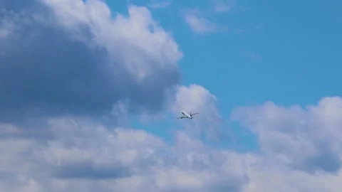 Airplane flying in the blue sky Stock Footage 236980024