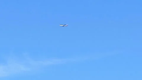 Airplane Flying in Blue Sky Video stock 341770176