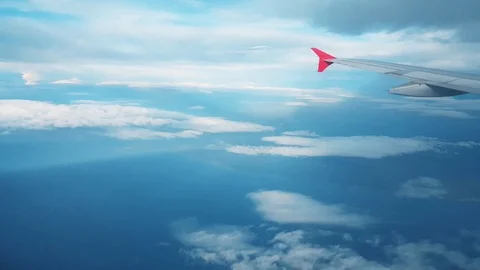 Airplane flying into the clouds, view from the window Stock Footage 104411532