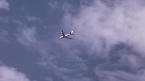 Airplane Flying in Cloudy Sky 1960s Vintage Film Stock Footage 301506891