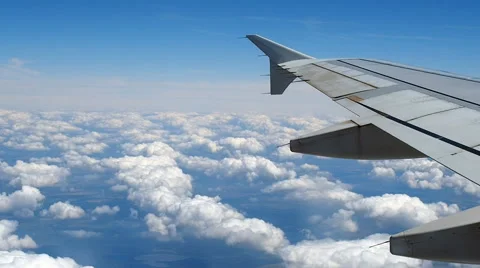 Airplane flying cloudy sky Stock Footage 64672444