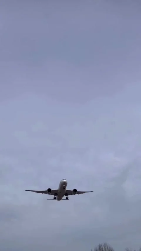 Airplane Flying in Cloudy Sky Low Angle View Video stock 331530829