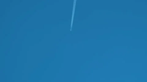 Airplane flying on deep blue sky 動画素材 292906694