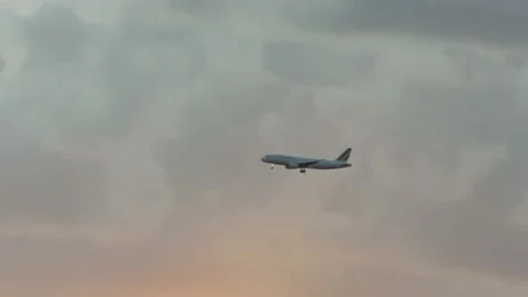 Airplane Flying in front of clouds at sunset 1 Video stock 162401878