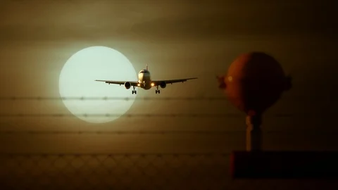 Airplane Flying in front of Large Sun at Sunset Sky Video stock 88621174
