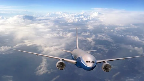 Airplane flying high above the clouds. Large passenger airliner in the sky Stockbeeldmateriaal 120643440