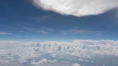 Airplane flying at high altitudes surrounded by clouds. Pilot’s view Stock Footage 88341323