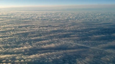 Airplane flying high with long white contrail from cockpit view Stock Footage 277519635