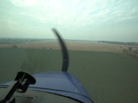 Airplane flying at low altitude Stock Footage 79075474